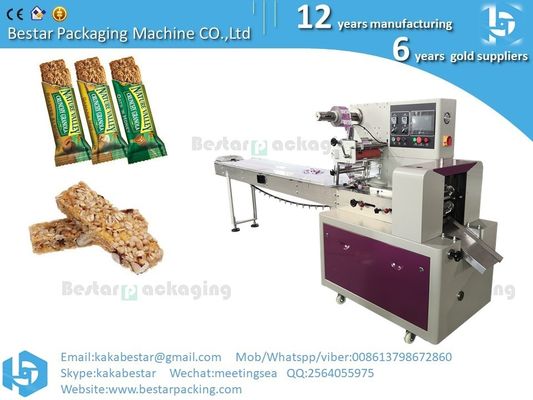 Máquina de embalaje de barras de chocolate de energía de granola de caramelo automática de flujo proveedor