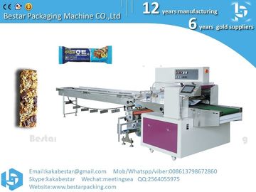 Máquina de embalaje de caramelos automática Máquina de embalaje de barras de chocolate Máquina de embalaje de barras de proteínas proveedor